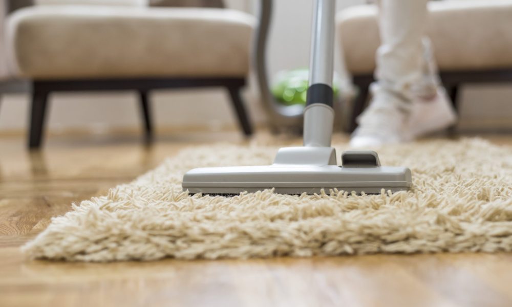 A closeup of a vacuum cleaner at a living room