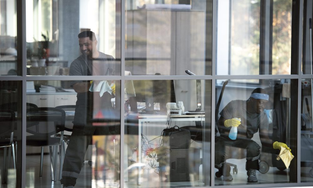 full-shot-smiley-man-cleaning-window